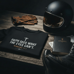 Flat lay mockup of black Christian biker T-shirt featuring “Faith Sees What Eyes Can’t” design with motorcycle helmet, gloves, boots, and Bible-inspired rider lifestyle styling.