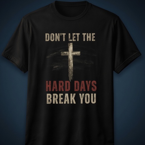 Black t-shirt with cross graphic and motivational text on a dark background
