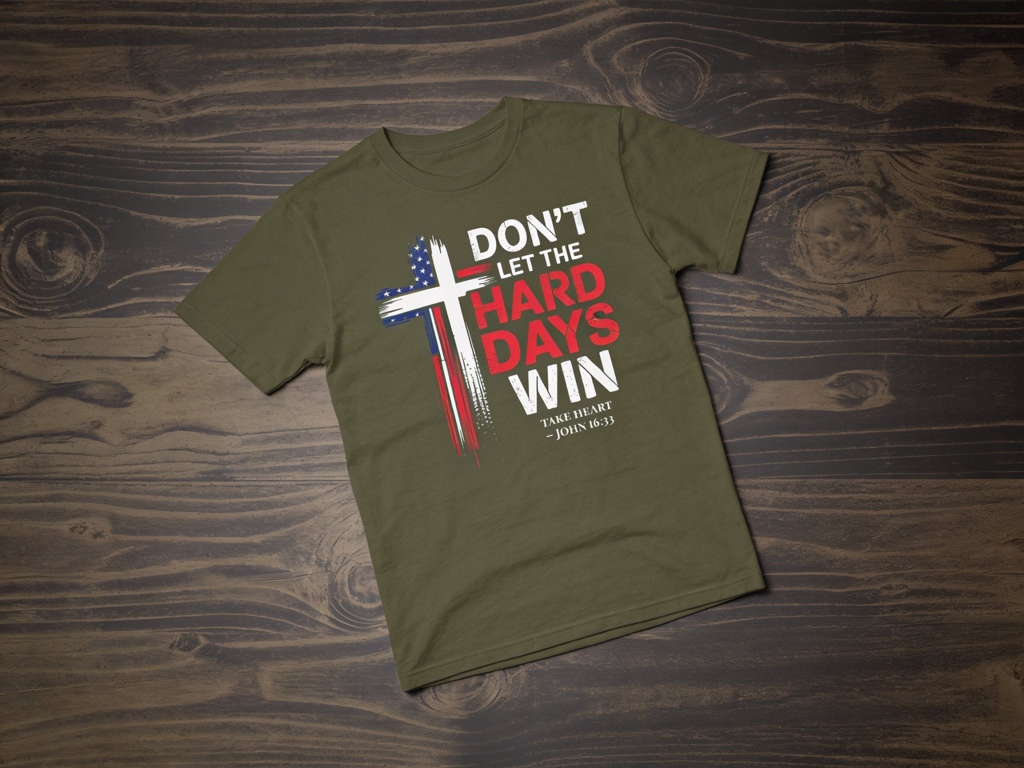 Don't Let the Hard Days Win Tee in Military Green — flat lay on rustic wood background — Held & Anchored