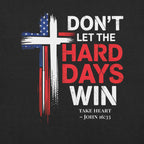 Don't Let the Hard Days Win Tee — close-up of distressed cross and John 16:33 print — Held & Anchored