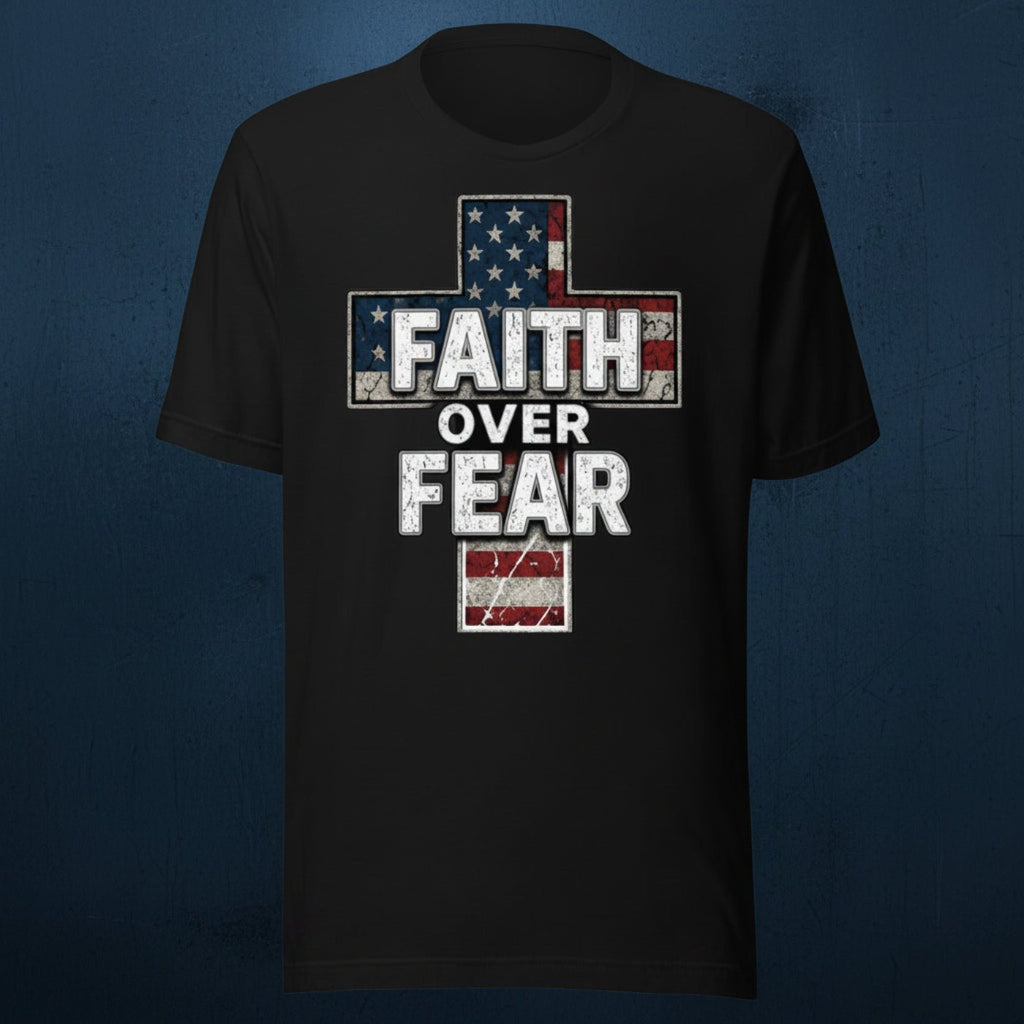 Black t-shirt featuring a distressed American flag cross design with bold “Faith Over Fear” lettering in white over a weathered patriotic cross graphic on a dark textured blue background.