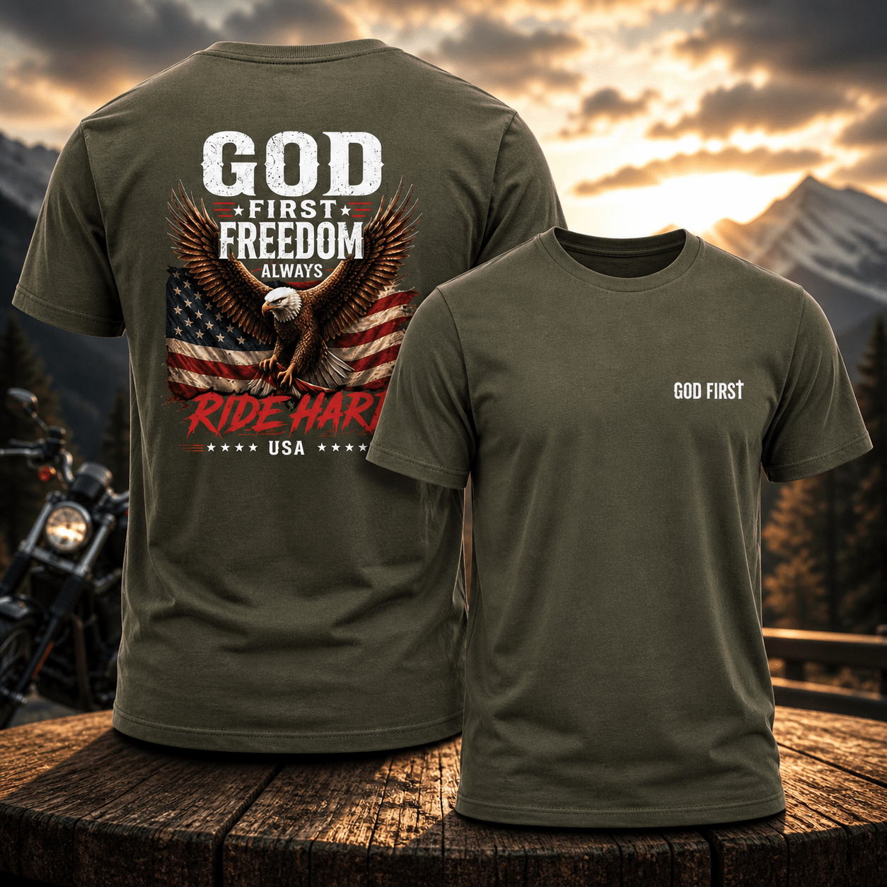 Green t-shirt with 'God First Freedom Always Ride Hard USA' design on a wooden surface with a sunset and mountains in the background.