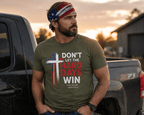 Outdoor lifestyle image of a man wearing the Don't Let the Hard Days Win faith-based t-shirt and Take Heart patriotic bandana near a pickup truck at sunset, symbolizing courage, resilience, and trust in God.
